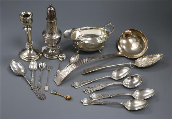 A George III embossed silver sugar caster (weighted), a silver sauce boat, Birmingham 1960 and sundry other silver and plated items